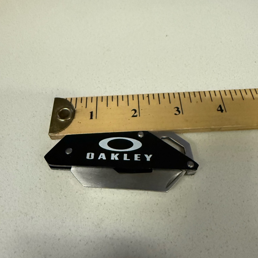 Oakley Black and Silver Folding bottle Opener Pry Bar